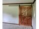 Interior shot of a sliding barn door showcasing the carpentry and space-saving design at 540 Lazy Ln, Greenwood, IN 46142