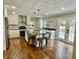 Spacious kitchen featuring modern appliances, center island with seating, and beautiful wood floors at 540 Lazy Ln, Greenwood, IN 46142