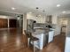 Open concept kitchen with center island, modern appliances, and seamless access to a living space at 540 Lazy Ln, Greenwood, IN 46142