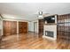 This living room features a fireplace, built-in shelving, and wood flooring at 540 Lazy Ln, Greenwood, IN 46142