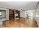 This living room features a fireplace, built-in shelving, and a view to the kitchen at 540 Lazy Ln, Greenwood, IN 46142