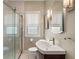 Well-lit bathroom with shower, window, and modern sink at 5424 Broadway St, Indianapolis, IN 46220