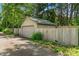 Garage with side fence and landscape at 5424 Broadway St, Indianapolis, IN 46220