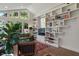 Bright living room with large windows and built-in shelving provides ample natural light and storage space at 5424 Broadway St, Indianapolis, IN 46220