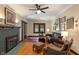 Comfortable living room with fireplace, hardwood floors, and plenty of seating at 5424 Broadway St, Indianapolis, IN 46220