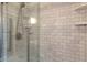 Shower with marble tile and glass door at 5424 Broadway St, Indianapolis, IN 46220