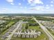 A beautiful aerial view of a residential community with well-maintained lawns and landscaping, set against a lush green backdrop at 5723 Arctic Run Dr, Noblesville, IN 46062