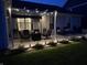 Inviting backyard patio enhanced by string lights, outdoor furniture and manicured landscaping at 5723 Arctic Run Dr, Noblesville, IN 46062