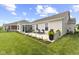 Backyard with a patio, outdoor seating, a well-maintained lawn, and tasteful landscaping at 5723 Arctic Run Dr, Noblesville, IN 46062