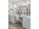 Bathroom vanity featuring dual sinks, pendant lighting, and a chair at 5723 Arctic Run Dr, Noblesville, IN 46062