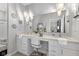 Bathroom with a vanity with dual sinks, granite counters, and decorative lighting at 5723 Arctic Run Dr, Noblesville, IN 46062
