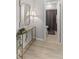 Neutral tones highlight the hall bathroom with a decorative mirror and sleek fixtures at 5723 Arctic Run Dr, Noblesville, IN 46062