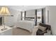 Cozy bedroom features a bed with a fluffy white blanket, neutral walls, and accent pillows at 5723 Arctic Run Dr, Noblesville, IN 46062