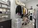Walk-in closet with shelves, storage, a full length mirror, and a black dresser at 5723 Arctic Run Dr, Noblesville, IN 46062