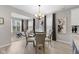 Bright dining area featuring modern lighting and seamless flow to living space at 5723 Arctic Run Dr, Noblesville, IN 46062