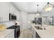 Contemporary kitchen featuring white cabinets, stainless steel appliances, and center island at 5723 Arctic Run Dr, Noblesville, IN 46062
