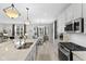 Bright, open kitchen with granite countertops, stainless steel appliances, and adjacent dining area at 5723 Arctic Run Dr, Noblesville, IN 46062