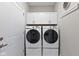Functional laundry room featuring new front load washer/dryer and matching cabinets at 5723 Arctic Run Dr, Noblesville, IN 46062