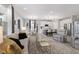 Open-concept living room flows into kitchen with modern island and stainless steel appliances at 5723 Arctic Run Dr, Noblesville, IN 46062