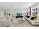 Open living room with two reclining chairs, a sofa, and a large area rug at 5723 Arctic Run Dr, Noblesville, IN 46062