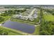A Primary-planned community features a tranquil pond with luxury homes offering picturesque waterfront views at 5723 Arctic Run Dr, Noblesville, IN 46062