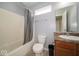 Functional bathroom features a tub-shower combo, toilet, and vanity, offering essential amenities at 5859 Edelle Dr, Indianapolis, IN 46237