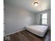 Well-lit bedroom with hardwood-style flooring, offering a comfortable and clean living space at 5859 Edelle Dr, Indianapolis, IN 46237