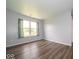 Well-lit bedroom with hardwood-style flooring and neutral walls, creating a serene atmosphere at 5859 Edelle Dr, Indianapolis, IN 46237