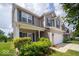Attractive two-story home with lush greenery, enhancing the curb appeal and creating a welcoming entrance at 5859 Edelle Dr, Indianapolis, IN 46237