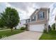 A well-kept two-story home with a spacious lawn, offering a welcoming curb appeal at 5859 Edelle Dr, Indianapolis, IN 46237