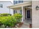 Inviting front porch featuring brick accents and manicured landscaping, creating a cozy entrance to the home at 5859 Edelle Dr, Indianapolis, IN 46237
