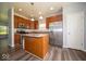 Well-equipped kitchen featuring an island, stainless steel appliances, and warm wood cabinetry at 5859 Edelle Dr, Indianapolis, IN 46237