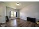 Spacious living room with hardwood floors, neutral paint, and ample natural light, perfect for relaxation at 5859 Edelle Dr, Indianapolis, IN 46237