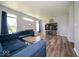 Open-concept living room with hardwood floors, a cozy fireplace, and plenty of space for entertaining at 5859 Edelle Dr, Indianapolis, IN 46237