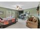 Comfortable bedroom featuring a ceiling fan, television, and comfortable seating at 5997 Hollythorn Pl, Carmel, IN 46033