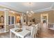 Dining room with decorative columns, french doors, and space for hosting large groups of people at 5997 Hollythorn Pl, Carmel, IN 46033