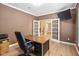 Home office with neutral walls, hardwood floors, and bright light at 5997 Hollythorn Pl, Carmel, IN 46033