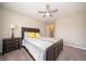 Bedroom featuring beige walls, and carpeting and a ceiling fan, as well as a connecting doorway to another room at 610 Sawtooth St, Westfield, IN 46074