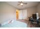 Bedroom featuring beige walls, and carpeting and a ceiling fan, and also including a closet and a connecting bathroom at 610 Sawtooth St, Westfield, IN 46074