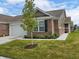 Charming brick home with a well-maintained lawn and attached garage at 610 Sawtooth St, Westfield, IN 46074