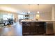 Open-concept kitchen with granite counters, stainless appliances, seamlessly integrated into dining and living area at 610 Sawtooth St, Westfield, IN 46074