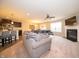 Inviting open-concept living space with fireplace, TV, and modern finishes connected to the kitchen at 610 Sawtooth St, Westfield, IN 46074