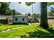Well-manicured backyard with stepping stone path, garden lighting, and a view of the home's exterior at 6146 Burlington Ave, Indianapolis, IN 46220