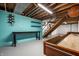 Finished basement featuring painted brick wall, shelving, and recreational space with wooden shuffleboard game at 6146 Burlington Ave, Indianapolis, IN 46220