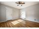 Bedroom featuring hardwood floors, neutral walls, and ceiling fan with lighting at 6146 Burlington Ave, Indianapolis, IN 46220