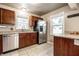 Well-lit kitchen featuring stainless steel appliances and granite countertops at 6146 Burlington Ave, Indianapolis, IN 46220