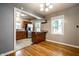 Open dining area flows into kitchen with stainless steel appliances and granite countertops at 6146 Burlington Ave, Indianapolis, IN 46220