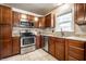 Modern kitchen with stainless steel appliances, custom cabinets and granite countertops at 6146 Burlington Ave, Indianapolis, IN 46220