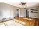 Spacious living room with hardwood floors and light gray walls, filled with natural light at 6146 Burlington Ave, Indianapolis, IN 46220
