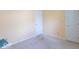Bedroom with neutral walls, carpet flooring, and two doors creating an adaptable space at 626 Tulip Poplar Ct, Mooresville, IN 46158